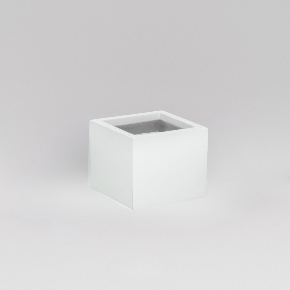 Antwerp Corner Fiberglass Planter in gloss bright white against gray background.