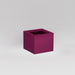 Antwerp Corner Fiberglass Planter in gloss eggplant against gray background.