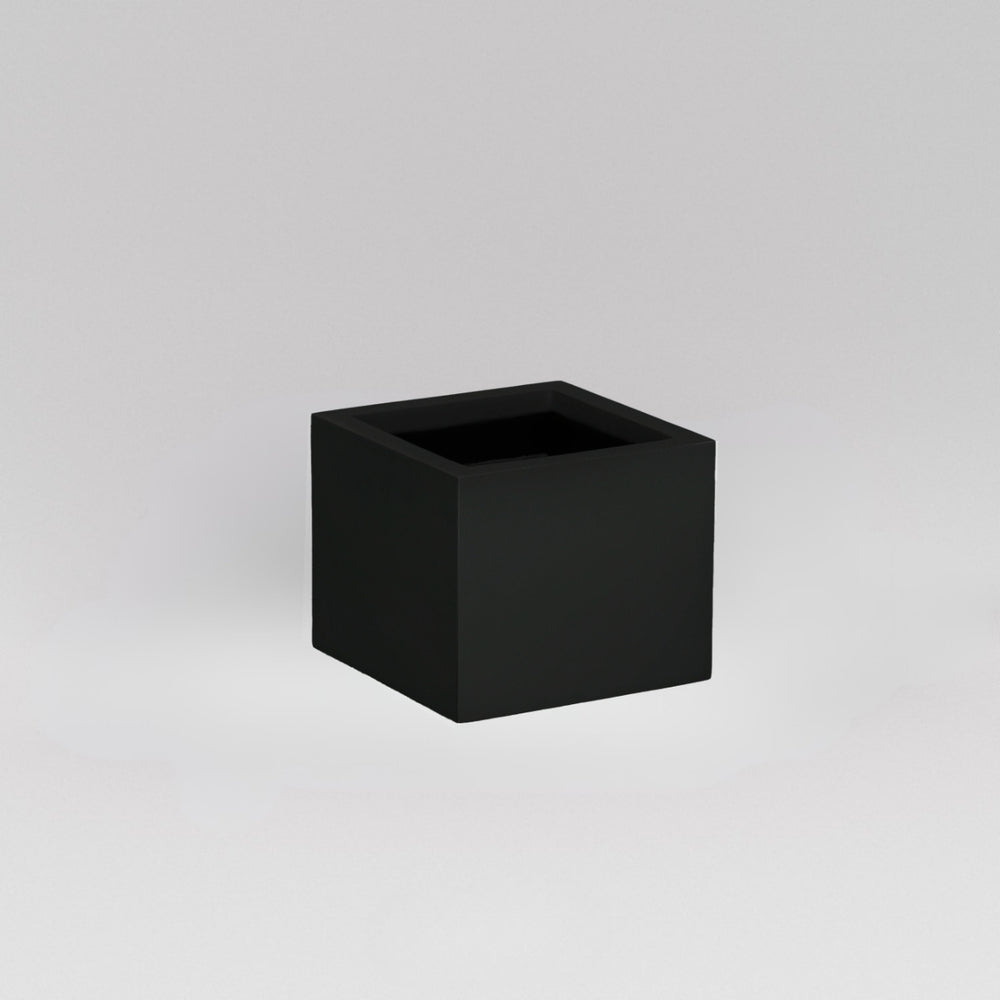 Antwerp Corner Fiberglass Planter in matte black against gray background.