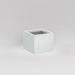Antwerp Corner Fiberglass Planter in matte bright white against gray background.