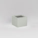 Antwerp Corner Fiberglass Planter in matte cement grey against gray background.