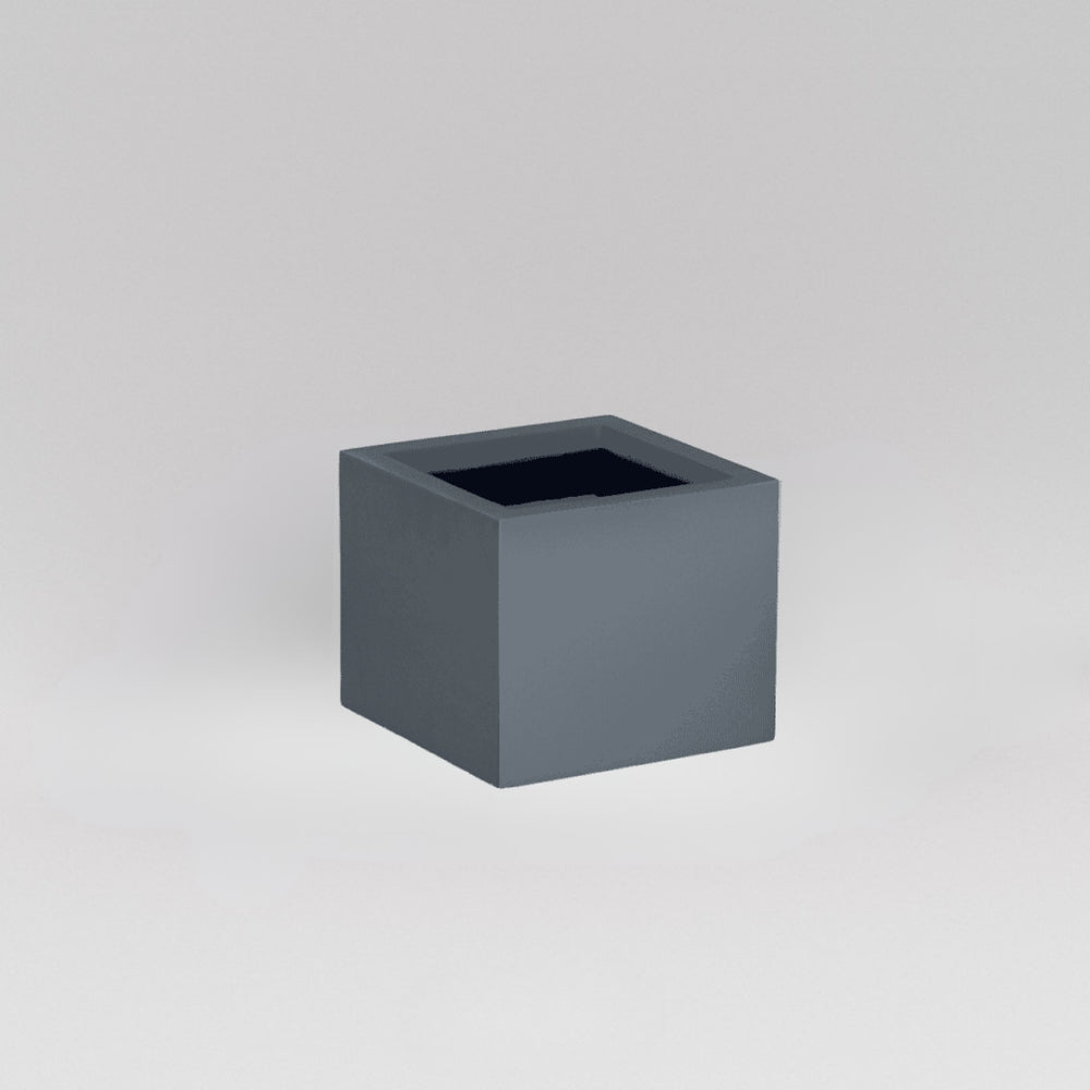 Antwerp Corner Fiberglass Planter in matte charcoal against gray background.