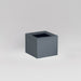 Antwerp Corner Fiberglass Planter in matte charcoal against gray background.