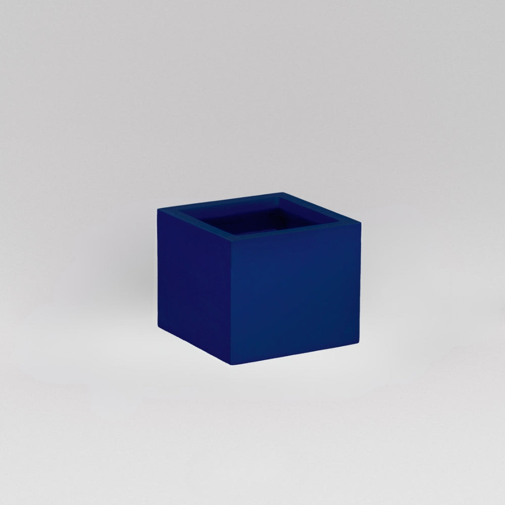Antwerp Corner Fiberglass Planter in matte cobalt blue against gray background.
