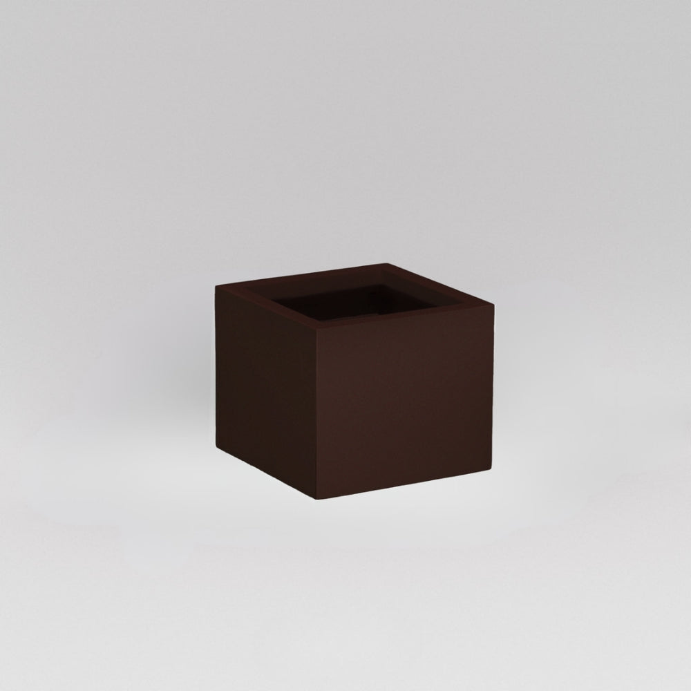 Antwerp Corner Fiberglass Planter in matte dark brown against gray background.