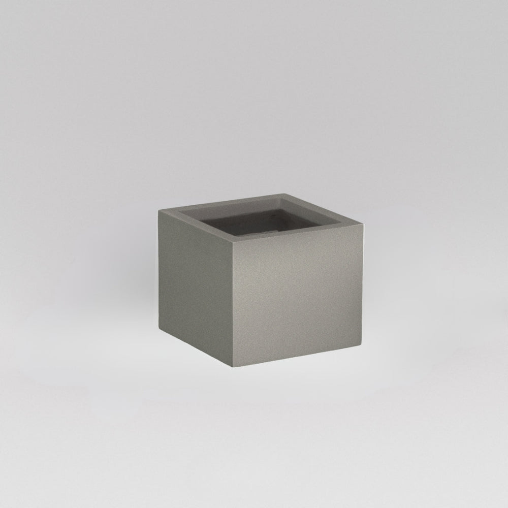 Antwerp Corner Fiberglass Planter in matte gunmetal against gray background.