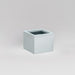 Antwerp Corner Fiberglass Planter in metallic silver against gray background.
