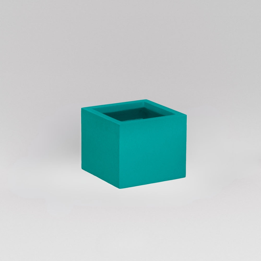 Antwerp Corner Fiberglass Planter in satin seafoam green against gray background.