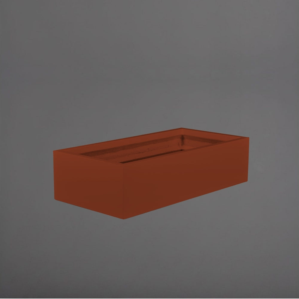 Antwerp Wide Rectangular Fiberglass Planter in matte terra cotta against gray background.
