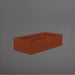 Antwerp Wide Rectangular Fiberglass Planter in matte terra cotta against gray background.