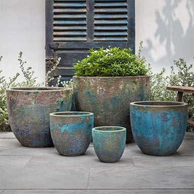 Apero Planter - Blue Verdigris - S/5 on concrete filled with plants