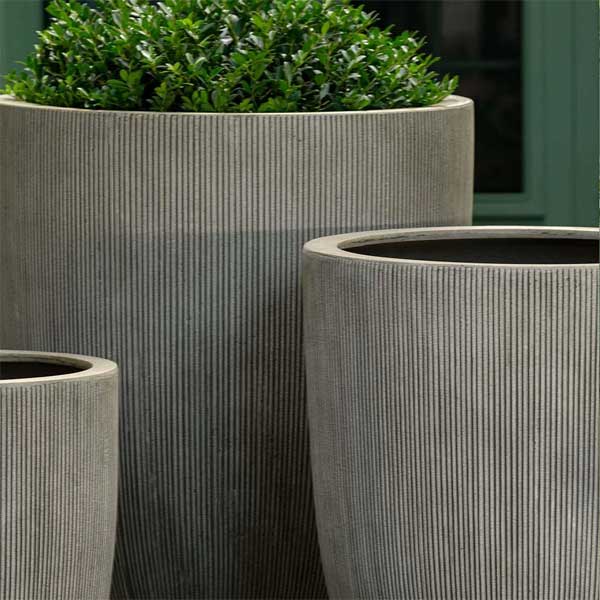 Argo Planter, Large - Ash Grey Lite on concrete filled with plants upclose