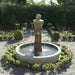 Avignon Pond Fountain surrounded with green plants.