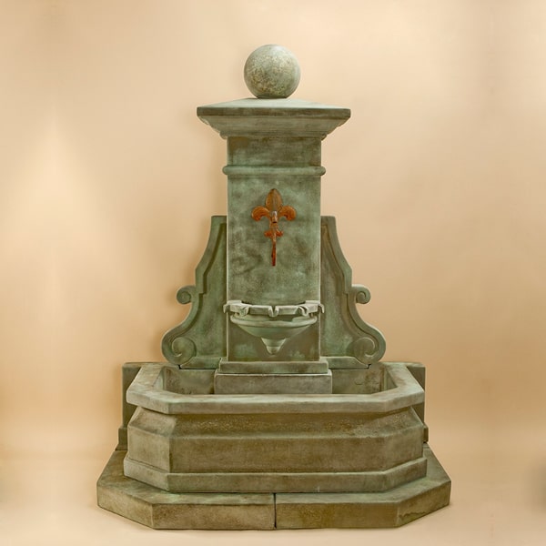 Avignon Wall Fountain against brown background.