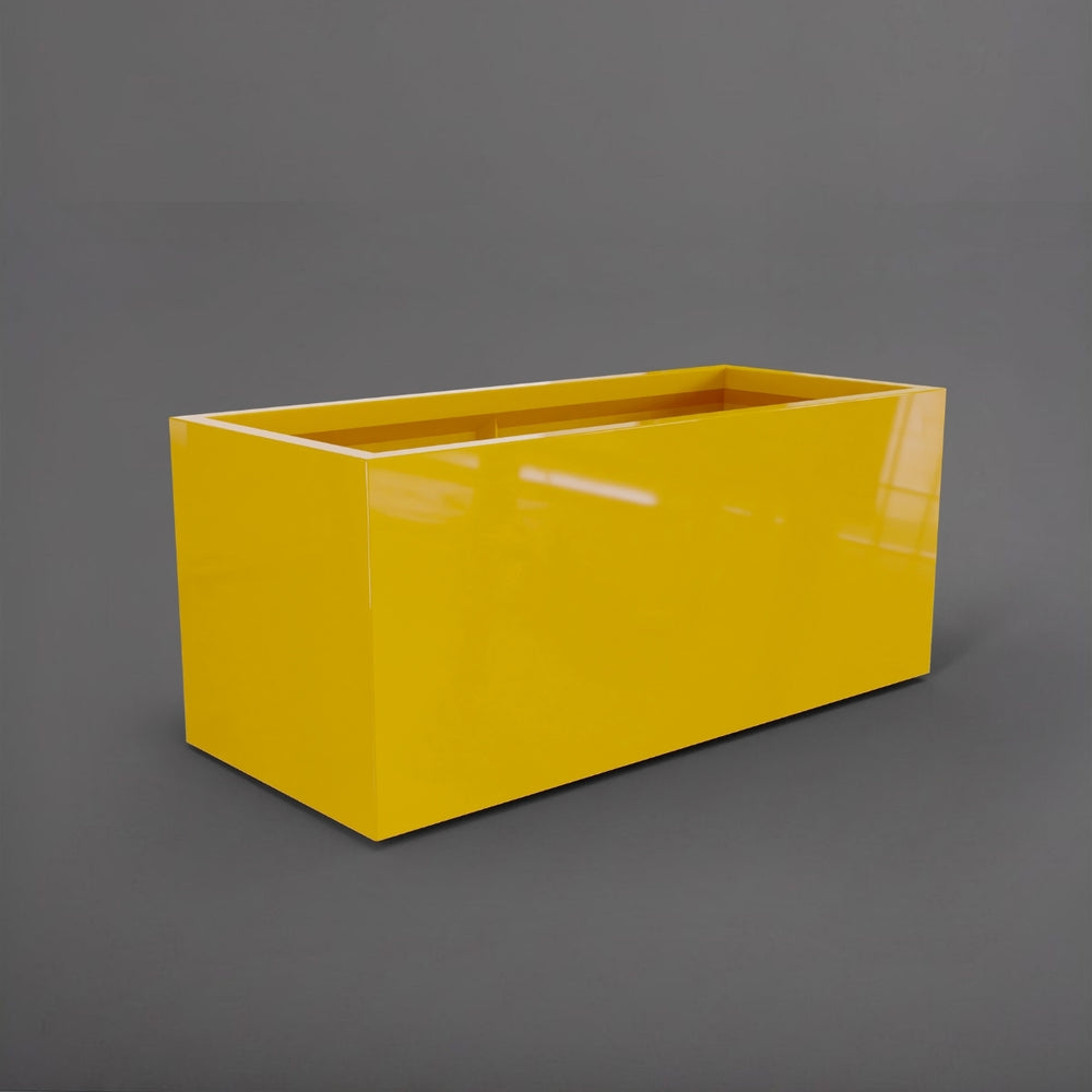 Badalona Rectangle Fiberglass Planter in gloss saffron against gray background.