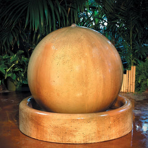 Ball and Ring Base Fountain in action against green leaves