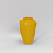 Bara Jar Tall Tapered Fiberglass Planter in gloss saffron against gray background.