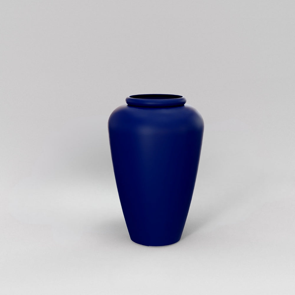Bara Jar Tall Tapered Fiberglass Planter in matte cobalt blue against gray background.