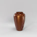 Bara Jar Tall Tapered Fiberglass Planter in metallic bronze against gray background.