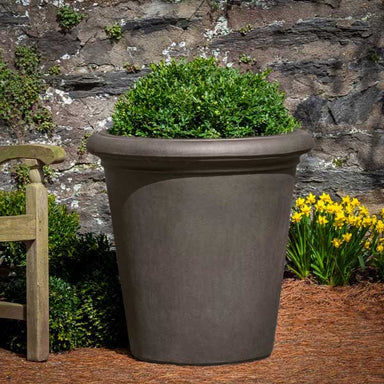 Barrington Planter - Peat - S/1 filled with plants in the backyard