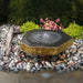 Basalt Bird Bath Fountain Kit on gravel in the backyard