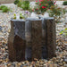 Basalt Fountain Kit 24 Triple Split polished 3 piece on mixed pebbles in the backyard