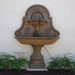 Belair Wall Fountain for spout in action against cream wall.