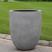 Bradford Planter Extra Large in stone gery premium color on concrete in the backyard.