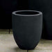 Bradford Planter, Extra Small - Onyx Black Lite - S/1 on concrete in the backyard