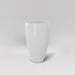 Brannan Tapered Round Fiberglass Planter in gloss bright white against gray background.