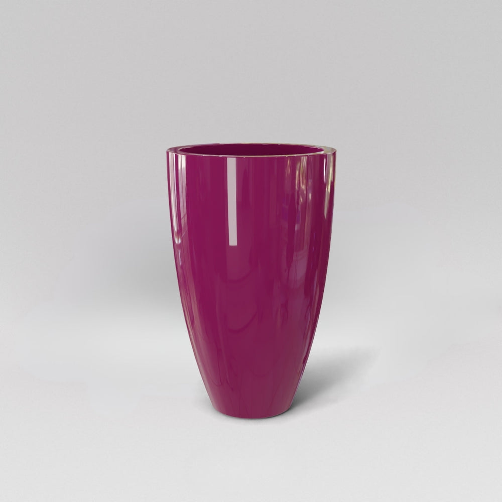 Brannan Tapered Round Fiberglass Planter in gloss eggplant against gray background.
