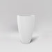 Brannan Tapered Round Fiberglass Planter in matte bright white against gray background.