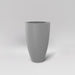 Brannan Tapered Round Fiberglass Planter in matte cement grey against gray background.