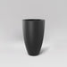 Brannan Tapered Round Fiberglass Planter in matte charcoal against gray background.