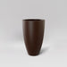 Brannan Tapered Round Fiberglass Planter in matte dark brown against gray background.
