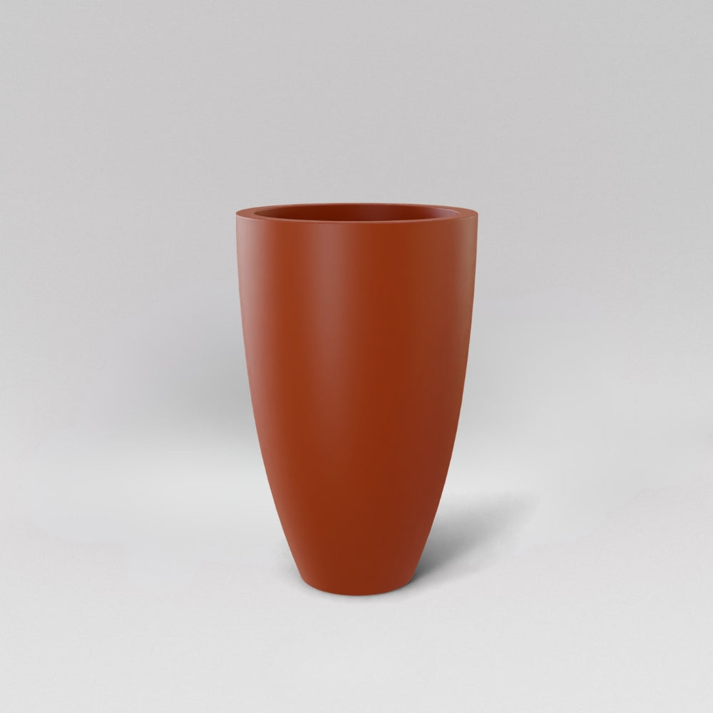 Brannan Tapered Round Fiberglass Planter in matte terra cotta against gray background.
