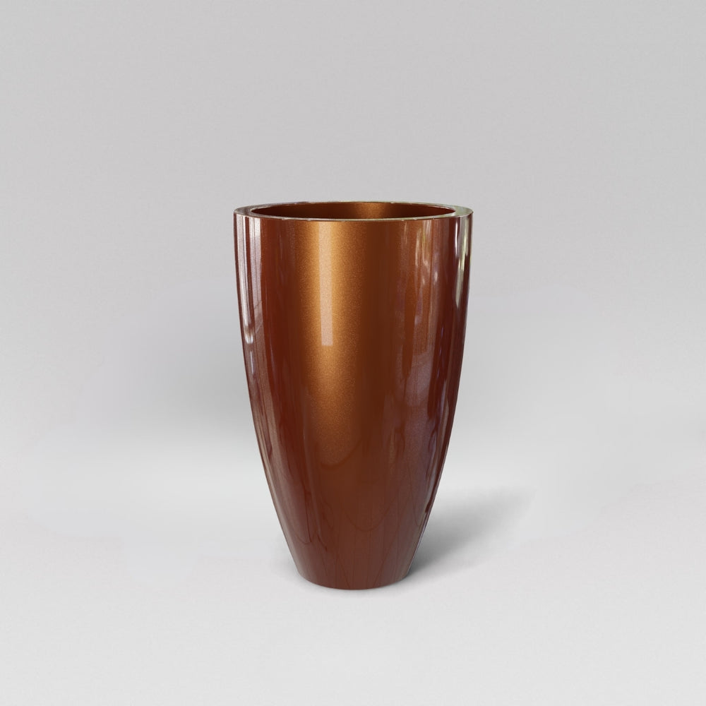 Brannan Tapered Round Fiberglass Planter in metallic bronze against gray background.