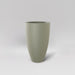 Brannan Tapered Round Fiberglass Planter in satin beige against gray background.