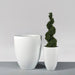 Brannan Tapered Round Fiberglass Planter shown with different sizes filled with plants.