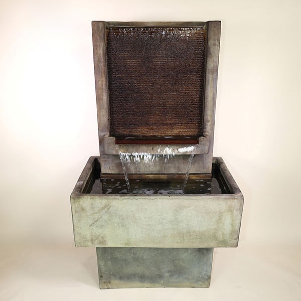 Brentwood Fountain Short with base against brown background.