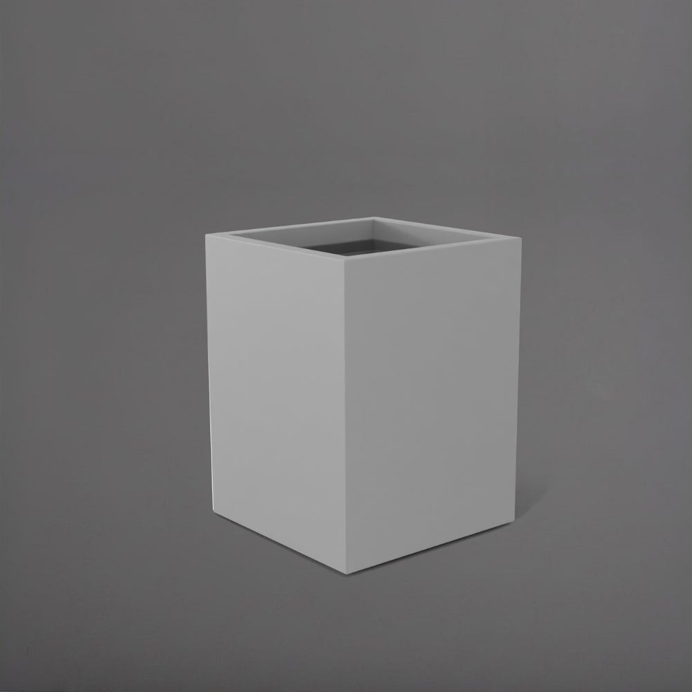 Brisane Tall Corner Fiberglass Planter in matte cement grey against gray background.