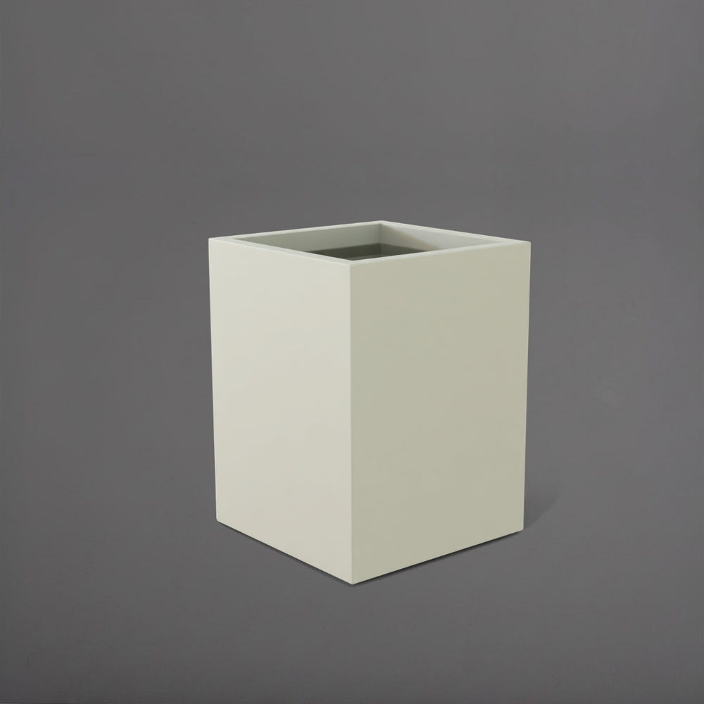 Brisane Tall Corner Fiberglass Planter in satin beige against gray background.