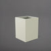 Brisane Tall Corner Fiberglass Planter in satin beige against gray background.