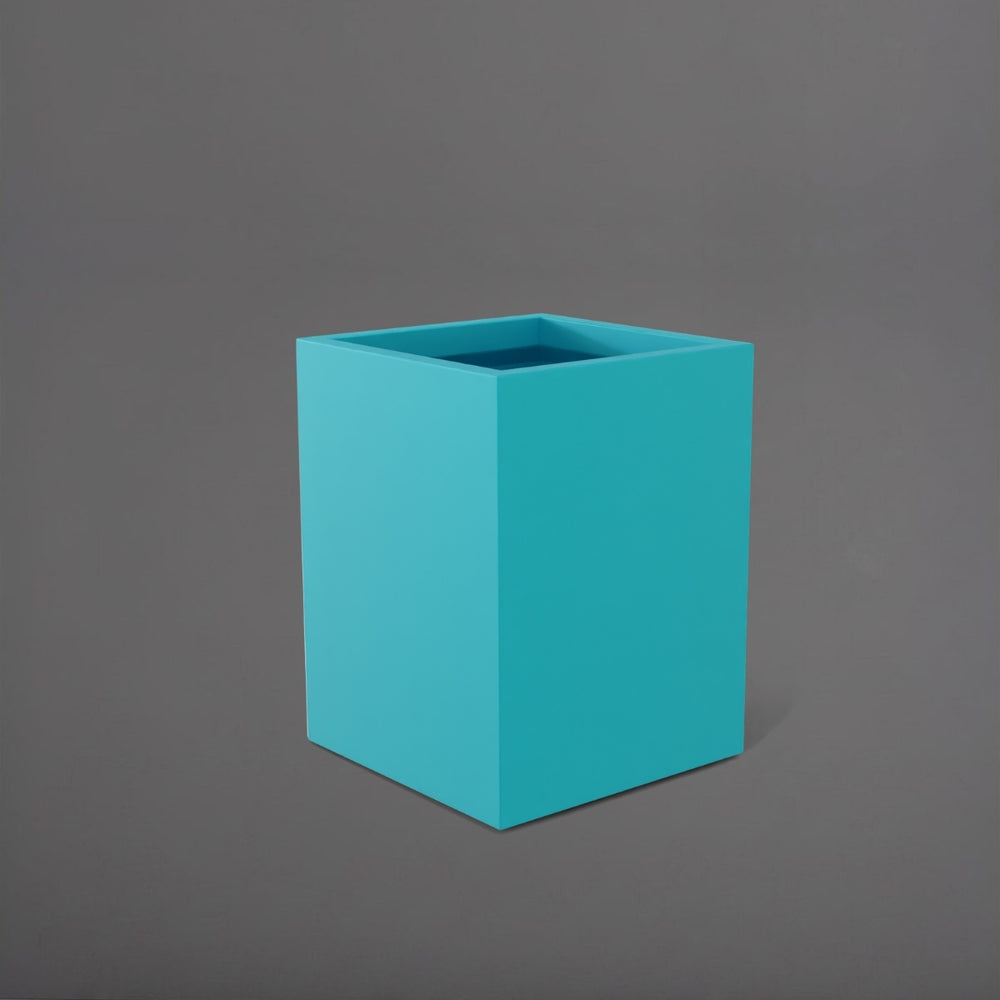 Brisane Tall Corner Fiberglass Planter in satin seafoam green against gray background.