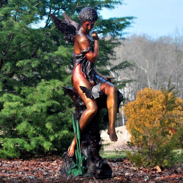 Bronze Butterfly Woman Fountain Sculpture in the backyard