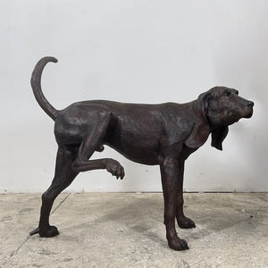 Bronze Peeing Dog Fountain Sculpture agaisnt gray background