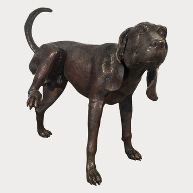 Bronze Peeing Dog Fountain Sculpture against gray background