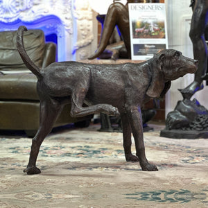 Bronze Peeing Dog Fountain Sculpture near couch