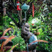 Bronze Whimsical Frog Fountain Sculpture in the backyard