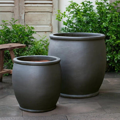 Brooke Planter in ash color on concrete in the backyard.
